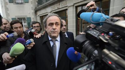Michel Platini shown surrounded by media at the Court of Arbitration for Sport in Luasanne, Switzerland on Tuesday. Laurent Gillieron / Keystone / AP / December 8, 2015
