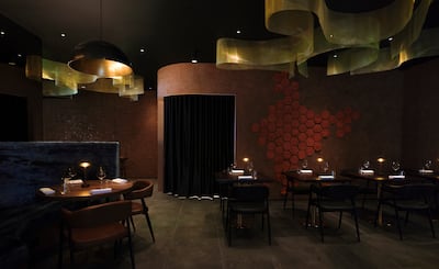 Dim lighting, warm leather accents and plush velvet booths at Tresind Mayfair. Photo: Tresind