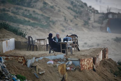 Palestinian women chat at Nuseirat refugee camp in central Gaza. AFP