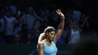Serena Williams waves to the crowd after beating Eugenie Bouchard at the WTA Finals on Thursday in Singapore. Wallace Woon / EPA / October 23, 2014