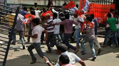 Indian students pelt stones at police during a protest demanding the creation of a new state named ‘Telangana’ in Hyderabad, India.