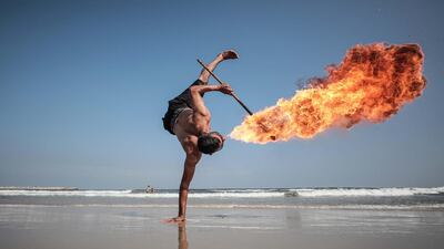 A member of the Gaza Breakdance Group performs by the seaside in the Palestinian territory. Photo by Majd Mahmoud