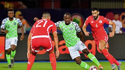 Ighalo makes a run at the Tunisia defence. AFP