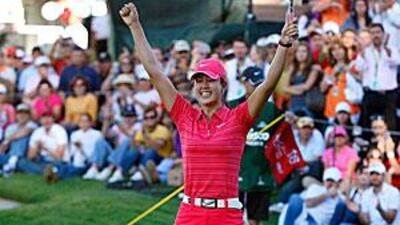 Michelle Wie celebrates after holing her winning putt in the Lorena Ochoa Invitational in Guadalajara.