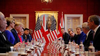 US President Donald Trump and Britain's Prime Minister Theresa May attend a business round-table discussion at St James's Palace during his state visit in London, Britain. Reuters