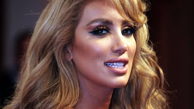 Lebanese dancer, actress and singer Maya Diab (member of The 4 Cats) arrives at the opening ceremony of the Abu Dhabi Film Festival (ADFF 2011) in Abu Dhabi, United Arab Emirates, 13 October 2011. ADFF 2011 will screen more than 200 films representing 4???