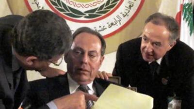 The Arab League Secretary General Amr Moussa (left), former Lebanese President Emile Lahoud and an aide talk at the start of the March 27 2002 Arab League summit in Beirut.