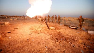 Peshmerga forces fire a mortar towards ISIL positions in the town of Naweran near Bashiqa and Mosul on October 23, 2016. Azad Lashkari/Reuters