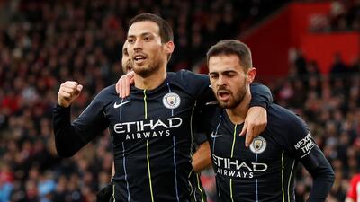 David Silva, left, celebrates opening the scoring for Manchester City in their 3-1 win over Southampton at St Mary's. Reuters