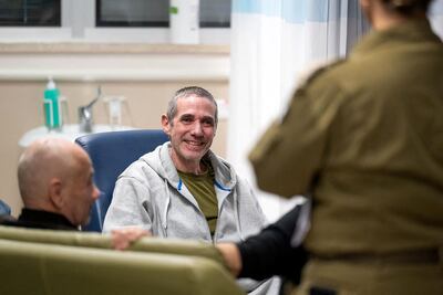Rescued Israeli-Argentinian hostage Fernando Simon Marman, centre, is reunited with his family at Tel Hashomer Hospital in Ramat Gan on the outskirts of Tel Aviv. AFP