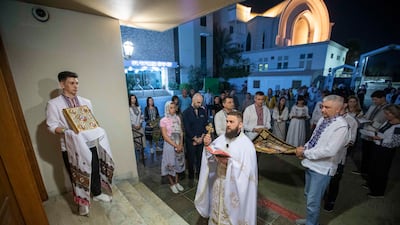 Worshippers pray at the steps of the Cathedral