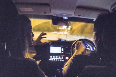Georgina is pictured speaking to 'John' the driver of the volunteer taxi as she is driven home from the protests. Rick Findler for The National