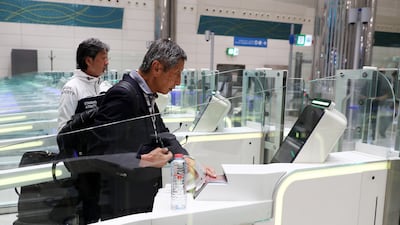 Emirates ID and a passport can be used to pass through immigration. Pawan Singh / The National