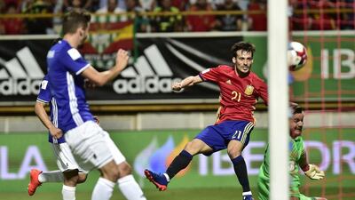 Spain midfielder David Silva shoots to score Spain’s third goal. Alvaro Barrientos / AP Photo