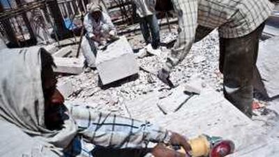 Labourers carve stone for a monument approved by Uttar Pradesh's chief minister, Mayawati.