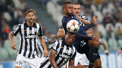 Juventus midfielder Patrice Vieira fights for the ball with Malmo's forward Isaac Thelin during their Uefa Champions League match on Tuesday. Marco Bertorello / AFP