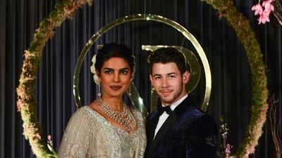 Newlyweds Priyanka Chopra and Nick Jonas pose for a photograph during a reception at a hotel in New Delhi on December 4, 2018. Photo: AFP