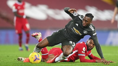 Manchester United's Aaron Wan-Bissaka in action with Liverpool's Georginio Wijnaldum. Reuters