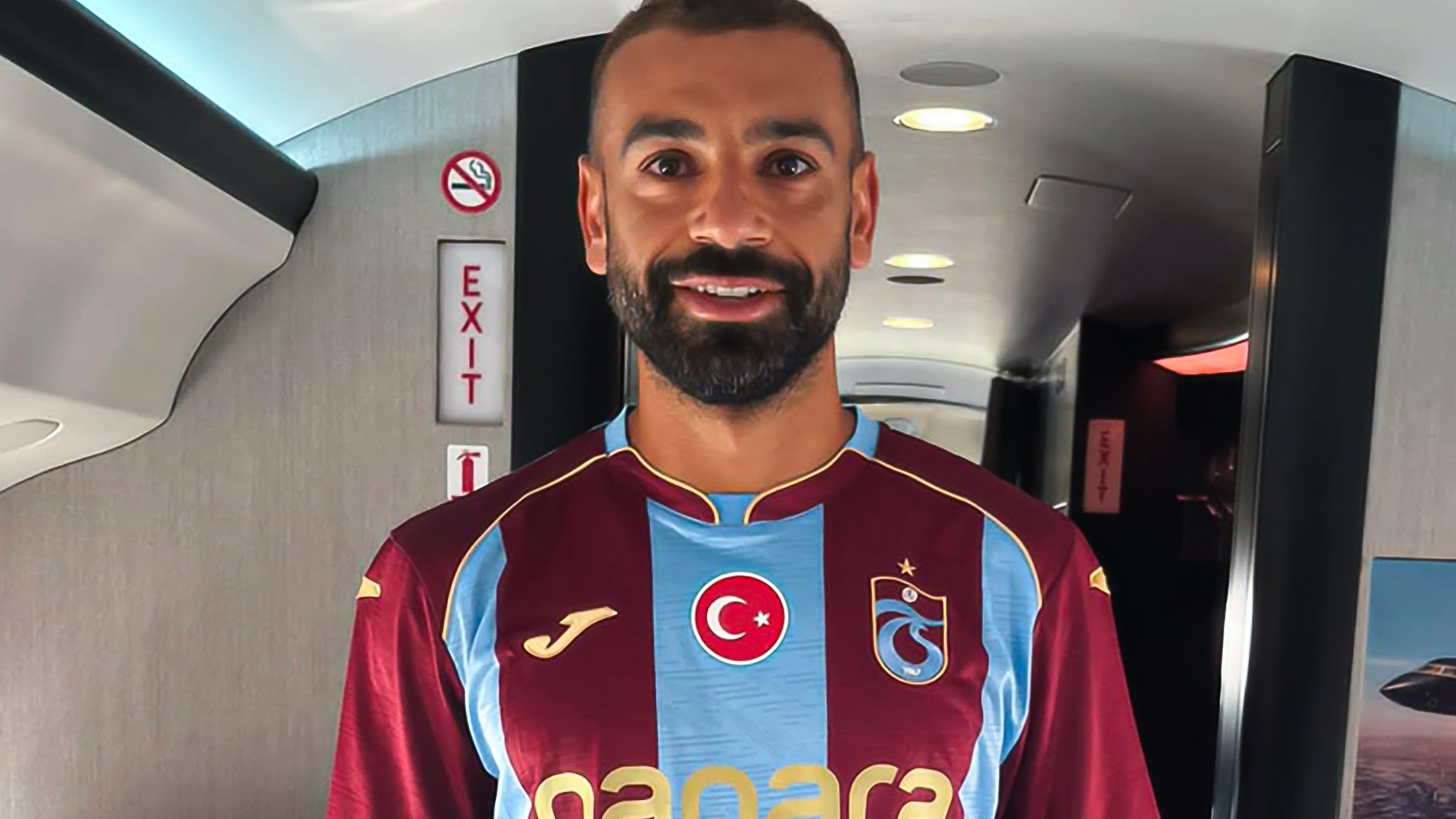 Image linked from the original feed: Mohamed Salah pictured in Trabzonspor jersey as he flies in to complete transfer