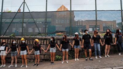 People form human chain outside the Maryknoll Convent School in Hong Kong on Friday, Sepember. 6, 2019. AP Photo