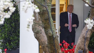 US President Donald Trump exits the White House while departing for Miami from the South Lawn in Washington, DC, on April 16, 2018. Joshua Roberts / Bloomberg