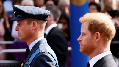 Prince William and Prince Harry march during a procession to bring their late grandmother's coffin to the Houses of Parliament for her lying in state. Reuters