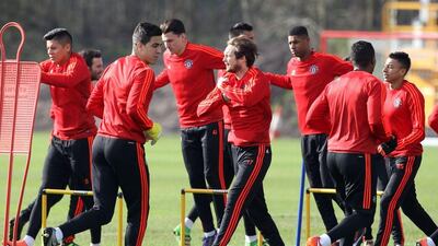 Manchester United players take part in a team training session at their Carrington Training Centre in Manchester, north west England on February 24, 2016. The gloom that has been descending on Manchester United lifted a little when they beat Shrewsbury in the FA Cup on Monday, but manager Louis van Gaal remains a man facing problems. United's manager has no margin for error as he attempts to maintain his team's chances of a European trophy when they face Midtjylland at Old Trafford on Thursday. / AFP / LINDSEY PARNABY