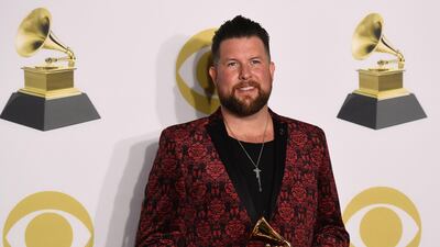 Zach Williams, winner of Best Contemporary Christian Music Album for 'Chain Breaker' poses in the press room. AFP