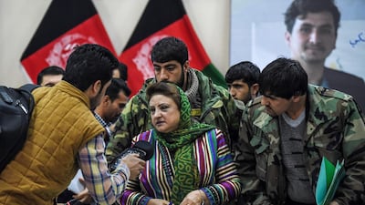 Head of the Afghan Independent Election Commission Hawa Alam Nuristani, centre, speaks to media representatives after announcing the final election results in a press conference in Kabul on February 18, 2020. AFP