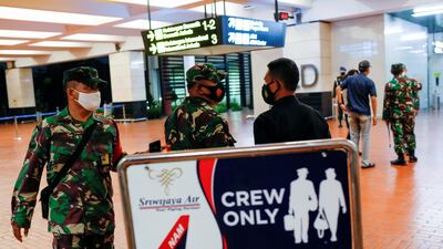 Indonesian soldiers are seen at Soekarno-Hatta International Airport after Sriwijaya Air plane flight SJ182 with more than 50 people on board lost contact after taking off, according to local media, in Tangerang, near Jakarta, Indonesia. Reuters