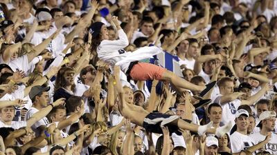Utah State students celebrate a touchdown in the fourth quarter of an NCAA college football game against UNLV in Logan, Utah. Rick Bowmer / AP Photo