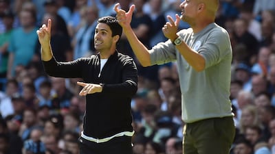 Arsenal manager Mikel Arteta, left, and Manchester City's Pep Guardiola are once again battling for the Premier League title. AP