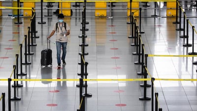 A passenger walks towards a counter in the Ninoy Aquino International Airport in Paranaque, Metro Manila, Philippines. Reuters