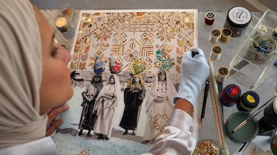 Barqawi uses embroidery, gold leaves and paint to revive old photos of Palestinians. Reuters