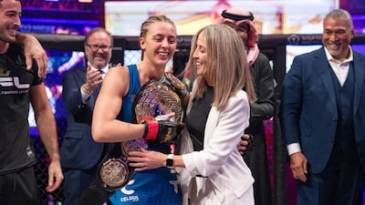 Dakota Ditcheva after receiving the 2024 PFL World Championship flyweight belt from her mother Lisa Howarth.