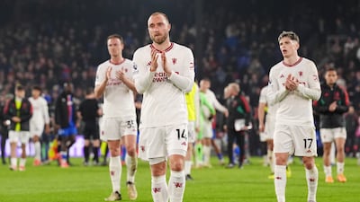 Christian Eriksen, Alejandro Garnacho, and Jonny Evans applaud the fans after Manchester United's 4-0 defeat to Crystal Palace at Selhurst Park in London on May 6, 2024. PA