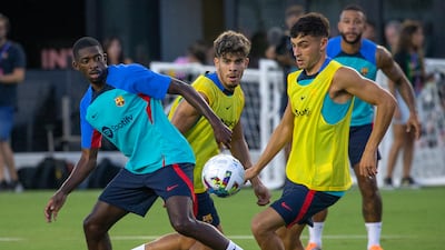 Ousmane Dembele and Pedri during the Barcelona open training at the DRV PNK Stadium. EPA