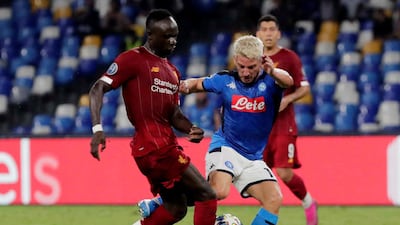 Napoli's Dries Mertens in action with Liverpool's Sadio Mane during Tuesday night's Champions League Group E match at the Stadio San Paolo in Naples, Italy. Napoli won the match 2-0. Reuters