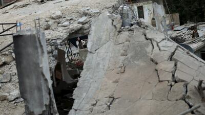 A woman looks at the rubble of the house of Muhammad Abu Shaheen after it was demolished by Israeli troops, at Qalandia refugee camp near the West Bank city of Ramallah on November 16, 2015. Israeli security forces said the Palestinian had taken part in an attack on Israel. Mohamad Torokman / Reuters
