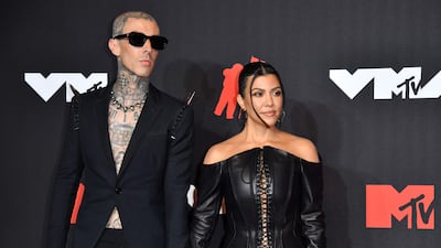 Drummer Travis Barker and personality Kourtney Kardashian arrive for the 2021 MTV Video Music Awards. AFP