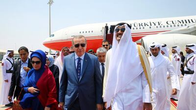 Turkey's President Recep Tayyip Erdogan is greeted by the Emir of Qatar, Sheikh Tamim bin Hamad Al Thani, upon his arrival in Doha on July 24, 2017. AP