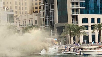 A yacht on fire in Dubai Marina. Rory Reynolds / The National