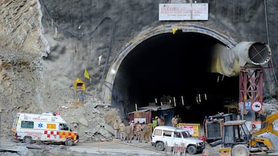 An ambulance arrives at the tunnel where workers are trapped. Reuters
