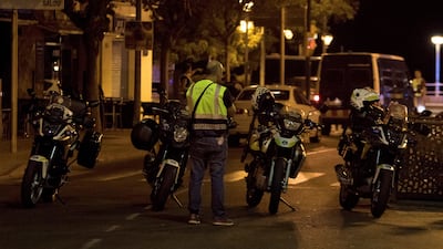 A police officer stands near the scene where police had killed five attackers in Cambrils. Reuters