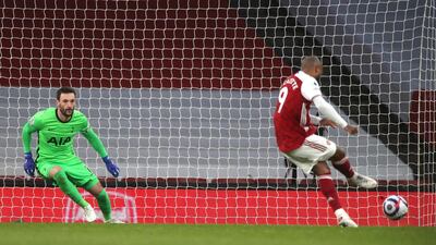 Arsenal's Alexandre Lacazette scores from the penalty spot against Tottenham Hotspur at the Emirates Stadium on Sunday, March 14, 2021. AP