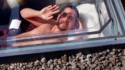 David Blaine waves from a Plexiglass coffin in a grave in 1999 for his Buried Alive stunt. Stan Honda / AFP