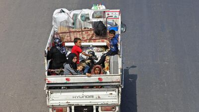 Residents of Idlib province flee towards the Syrian-Turkish border on September 10, 2018. AFP