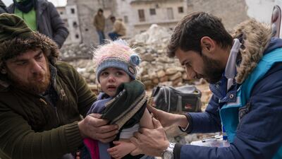 Amirah is screened for malnutrition by a Unicef-supported mobile health team worker in Aleppo. PA