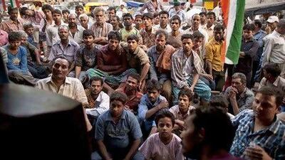 Fans watch the ICC World Cup cricket semifinal match between India and Pakistan in New Delhi.