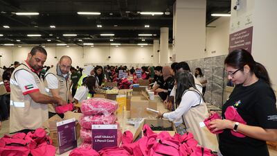 Volunteers pack kits for children during the Dubai Cares Back to School campaign at the Jafza One Convention Centre in Jebel Ali. All photos: Pawan Singh / The National